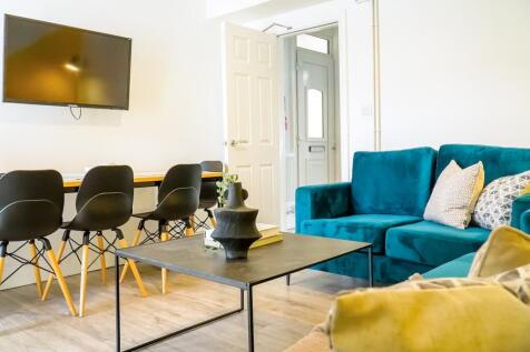 A bright and spacious modern living room featur...