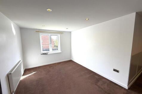Bright and spacious room with modern spotlights...