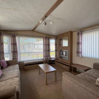 Bright open plan lounge inside ABI Derwent holiday