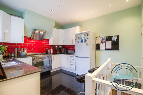 Kitchen with stairs to dining cellar below