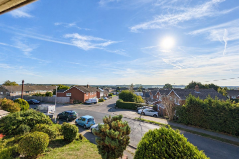 Sunny Suburban Street from Above.png