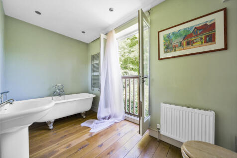 Family Bathroom with views over rear garden and elevated views over Ashdown Forest