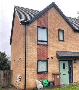 Two storey house with pale green door