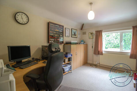 Bedroom two with tree lined view