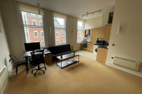 Bright open-plan living with large windows...
