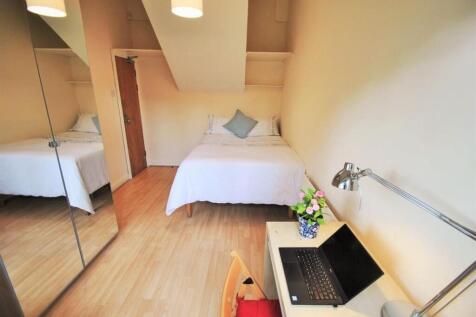 Bright, neatly presented bedroom with a comfort...