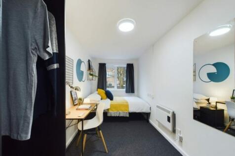 A stylish and well-lit double bedroom featuring...