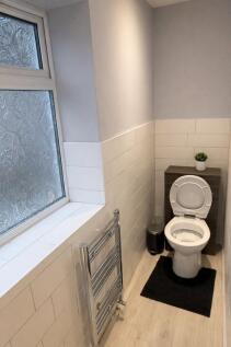 Bright, modern WC with frosted privacy window, ...
