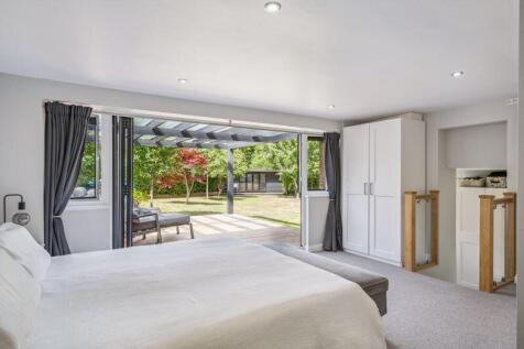 Main bedroom and doors to garden