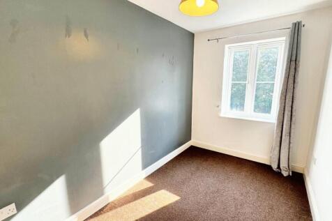 Bright bedroom with modern feature wall...