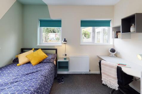 Bright, modern bedroom with a double bed, coord...