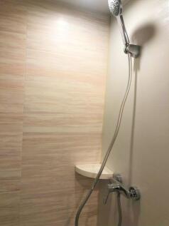 A clean and modern bathroom shower area featuri...