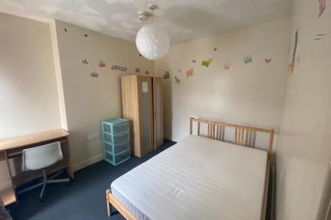 Bright bedroom with double bed and study desk...