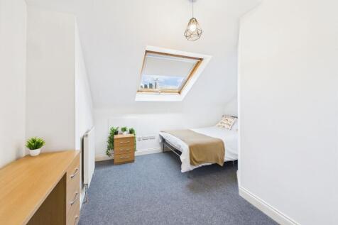 Bright, neatly presented loft bedroom with a sk...