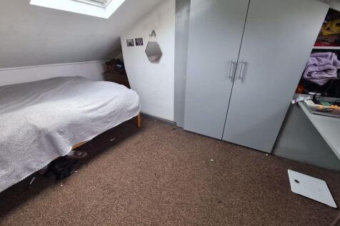 A clean and well-lit small room featuring a sky...