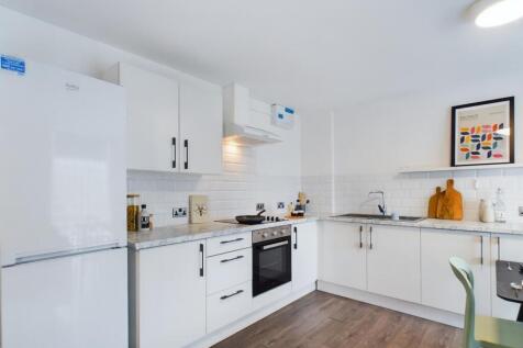 A bright and modern kitchenette featuring sleek...
