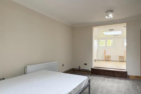 Spacious bedroom with bright adjoining sunroom ...