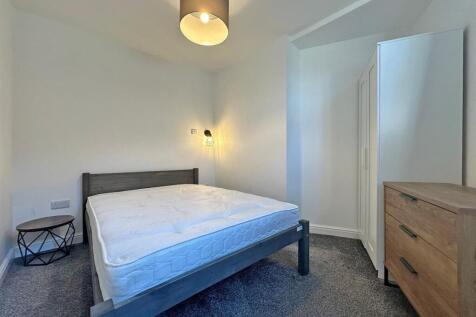 Bright modern bedroom with ample storage space....
