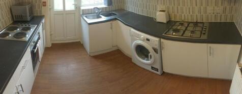 Bright, modern kitchen with laminate flooring, ...