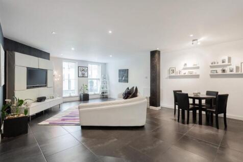 Expansive modern lounge with sleek dining area...