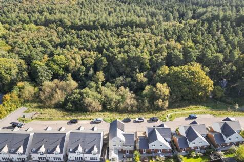 Fronted by Protected Woodland