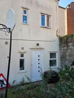 Street-level view of a two-storey rendered prop...