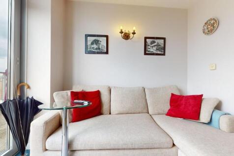 Bright cozy seating area with balcony access...