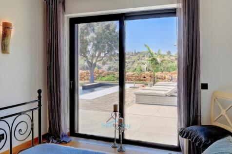 patio door to the pool and garden