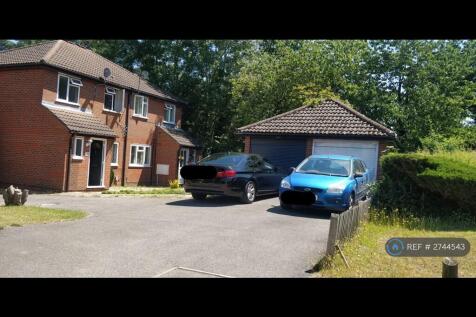 White Garage And Two Car Parkings In The Front