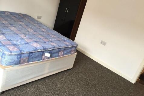 Bright bedroom with ample storage and double be...