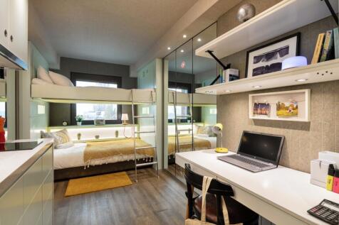 Modern bedroom with a dedicated study area...