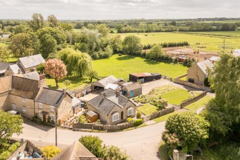Bungalow to left, plot to right