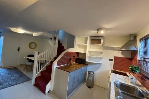 Bright and modern kitchen with ample counter sp...