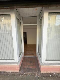 Bright entrance with large windows and tiled fl...