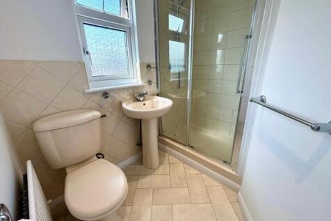 A bright and clean bathroom featuring a modern ...