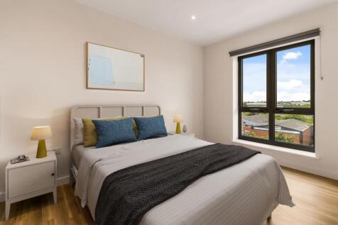Experience tranquility in this beautifully appointed bedroom with panoramic windows.