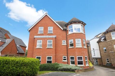Stunning red brick building with large windows...