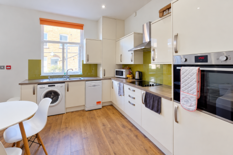 Bright Modern Kitchen with Green Backsplash