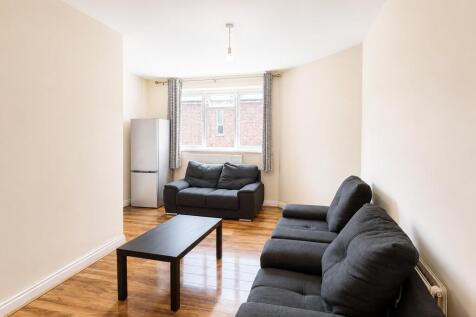 Bright lounge with comfy sofas and wood floors...