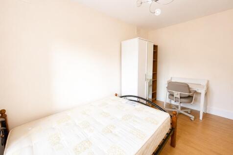 Bright bedroom with dedicated study workspace...