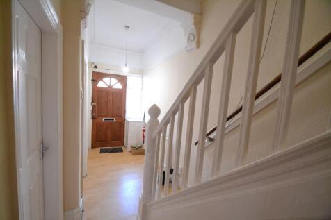 Bright, welcoming entrance hallway with wooden ...