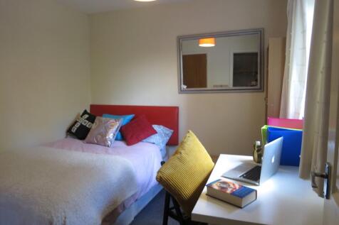 Bright, neatly presented bedroom with a comfort...