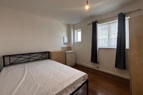 Bright double bedroom with modern wooden floors...