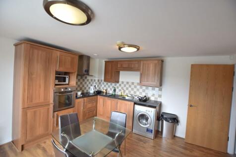 Modern kitchen with wooden cabinetry, integrate...