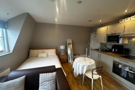 Bright, modern studio with a comfortable double...