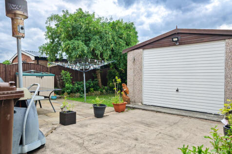 GARAGE AND REAR GARDEN 