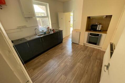 A neat and functional kitchen featuring modern ...