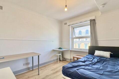 Bright, spacious bedroom with large study desk...