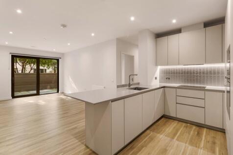 Experience elegance and spaciousness in this beautifully designed open-plan kitchen and living area.