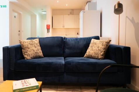 A cozy and inviting living room featuring a sty...